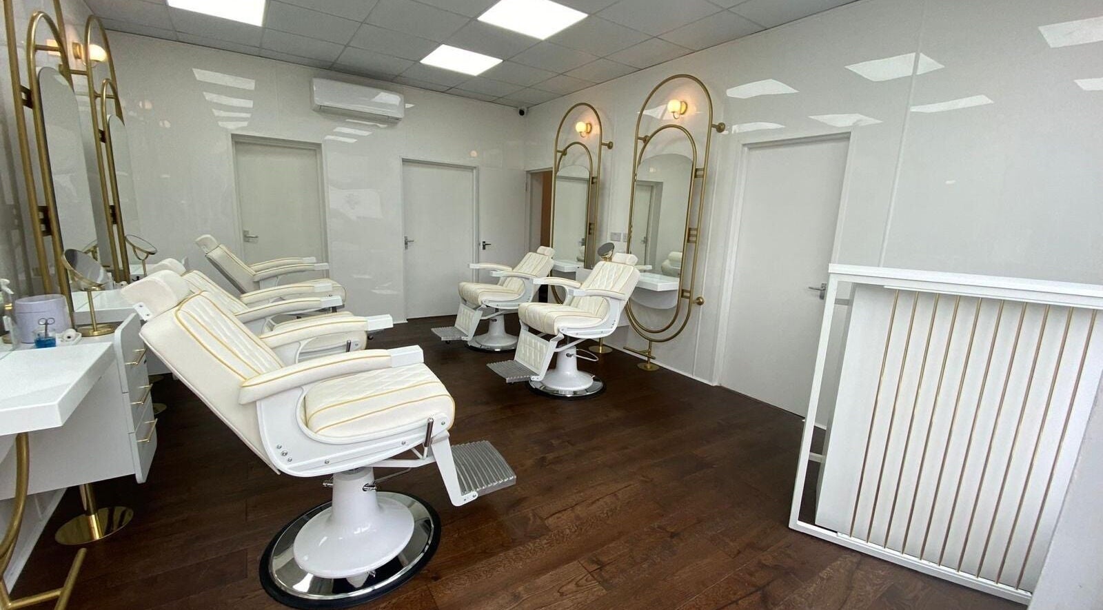 Modern salon interior with white chairs at Taz Beauty Brentwood, Brentwood, England, GB.