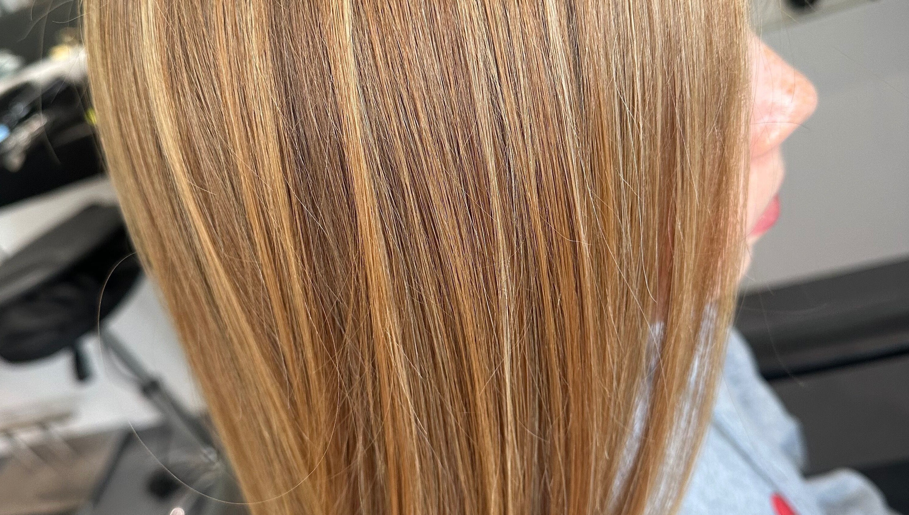 Close-up of blonde highlights at Kate Alexander Hair, Forfar, Scotland, GB, showcasing sleek styling.