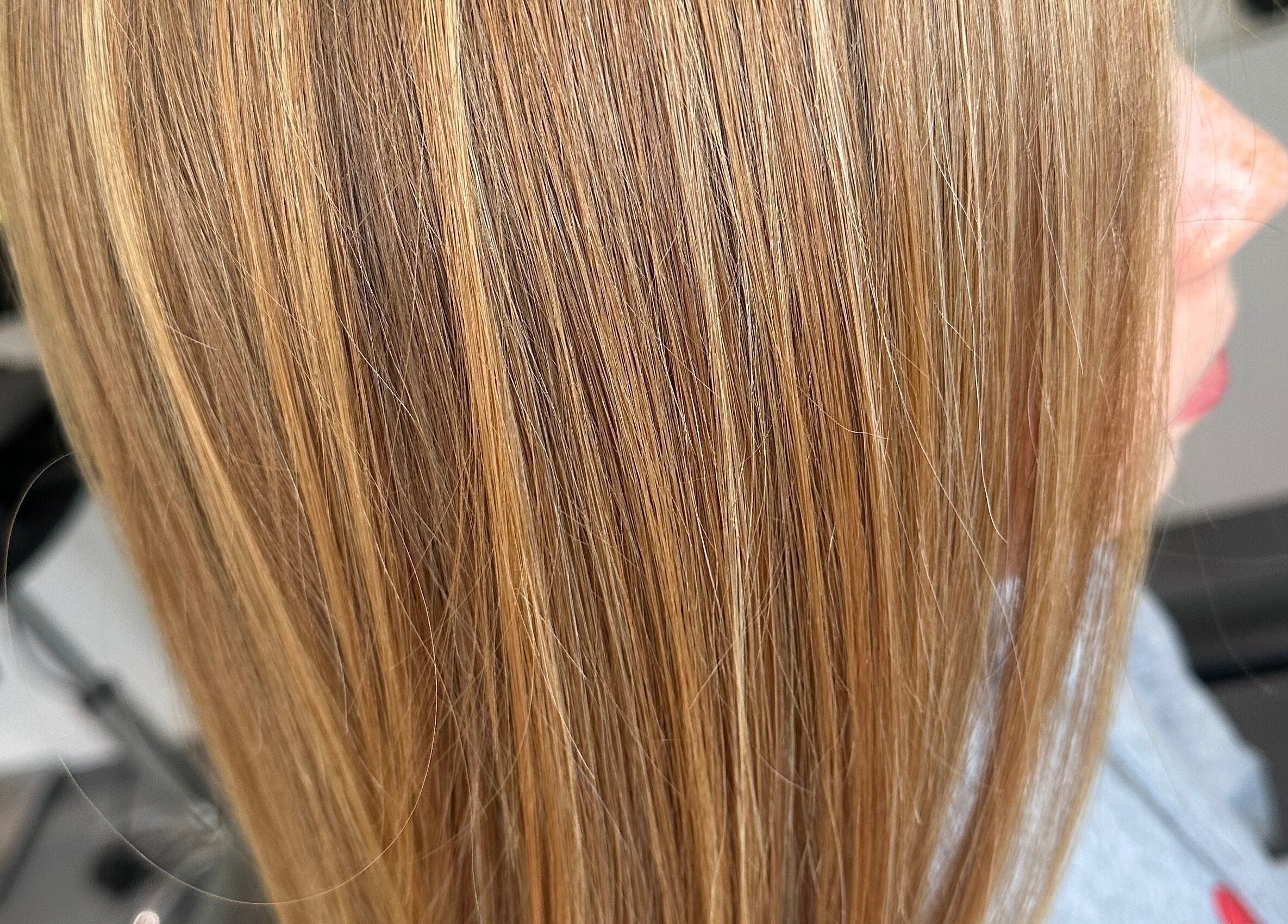 Close-up of blonde highlights at Kate Alexander Hair, Forfar, Scotland, GB, showcasing sleek styling.