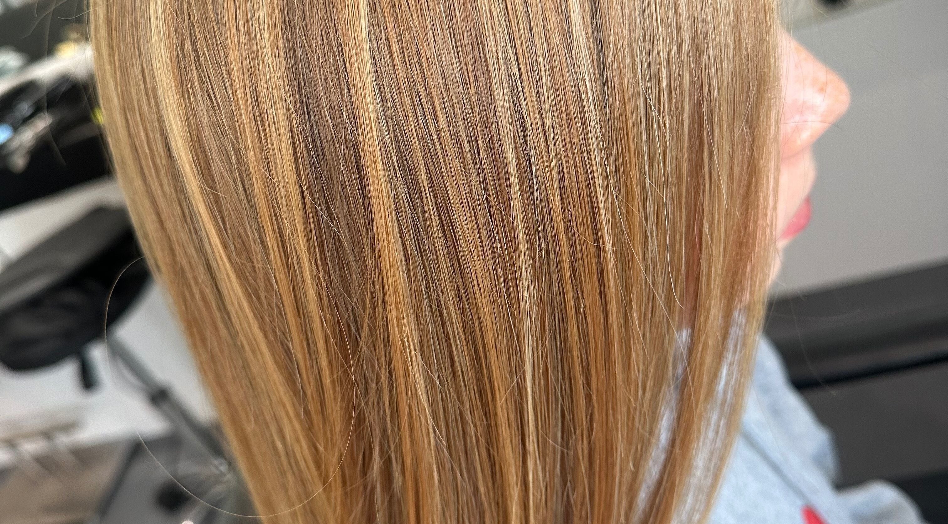 Close-up of blonde highlights at Kate Alexander Hair, Forfar, Scotland, GB, showcasing sleek styling.