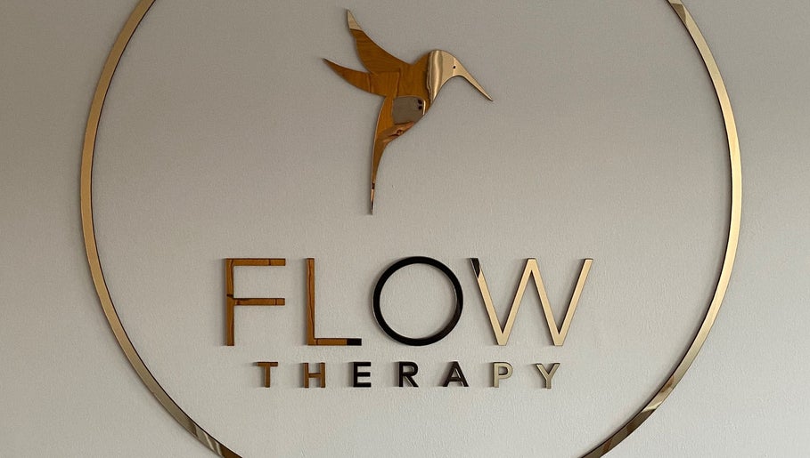 Flow Therapy sign featuring elegant gold bird logo in Seafield, Scotland, GB.