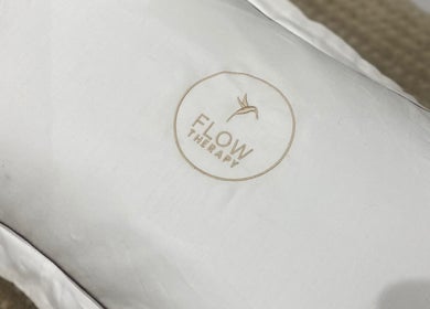 Flow Therapy pillow with logo at Seafield, Scotland, GB, enhancing relaxation experience.