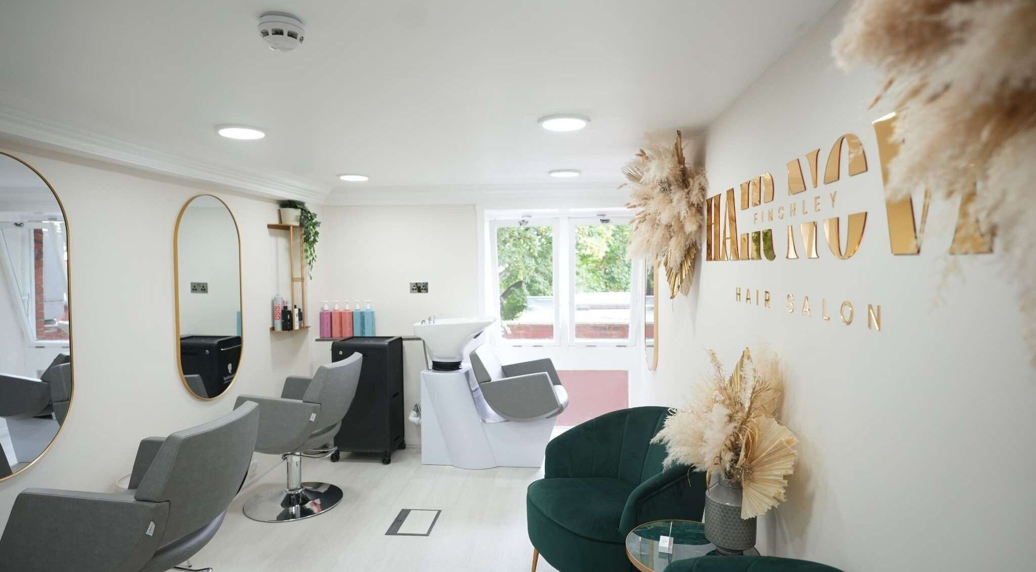 Interior of Hair Nova Finchley in London, England, GB, showcasing modern styling chairs and elegant decor.