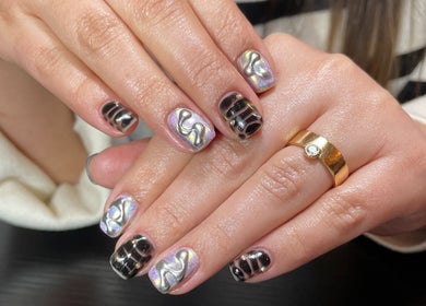Elegant nail art at Lizeth Nailed It, Berlin, Berlin, DE with metallic accents and stylish patterns.
