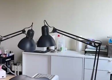 Cozy nail workspace at Lizeth Nailed It in Berlin, Berlin, DE, featuring stylish lamps and equipment.