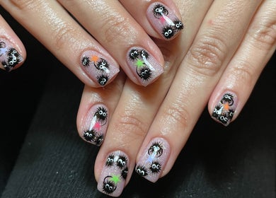Unique nail art with whimsical faces at Lizeth Nailed It, Berlin, Berlin, DE.