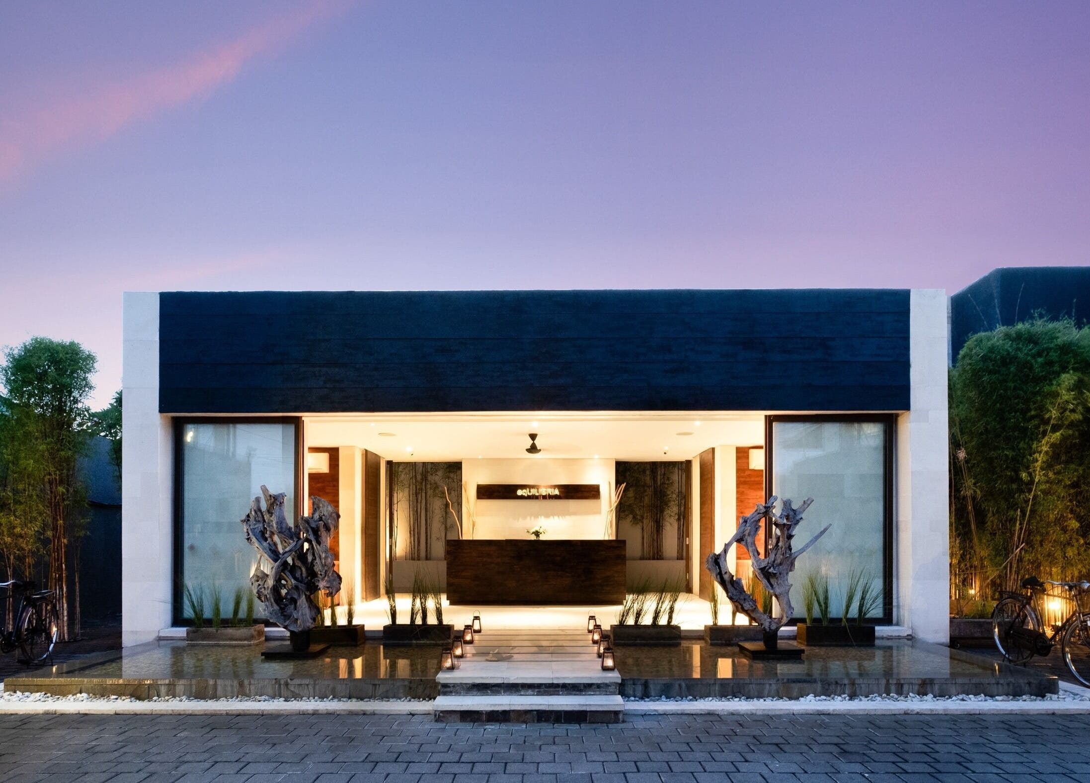 Entrance of eqUALIZE Spa in Kuta Utara, Bali, ID with modern decor and ambient lighting.