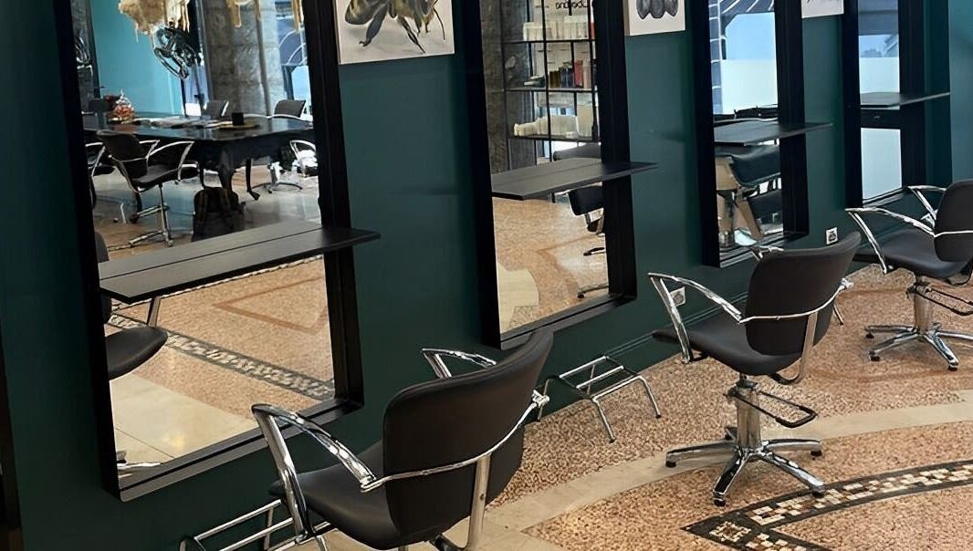 Modern salon chairs at Hair By Shlomi, Sydney, New South Wales, AU with sleek decor.