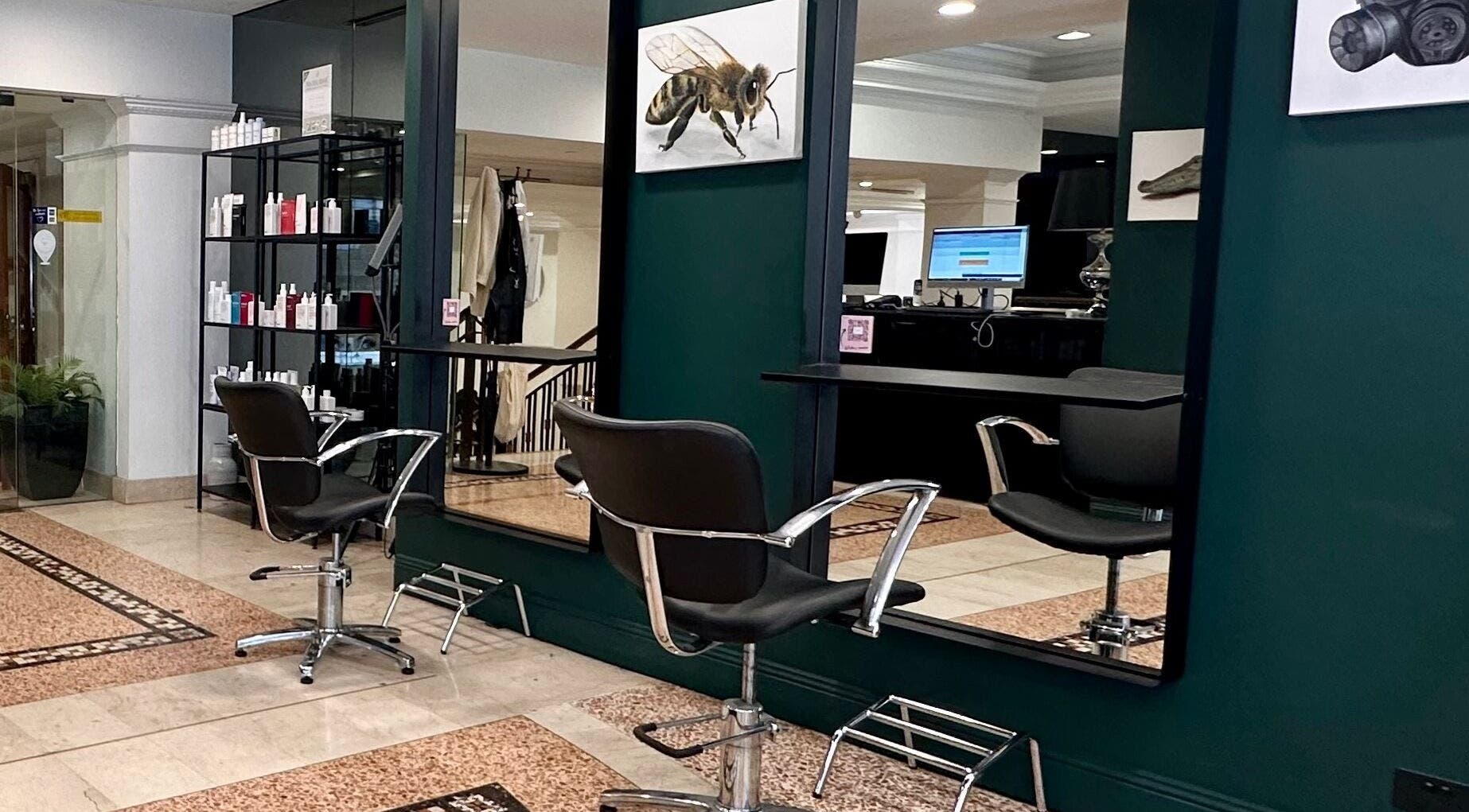 Modern salon chair and mirror at Hair By Shlomi in Sydney, New South Wales, AU.