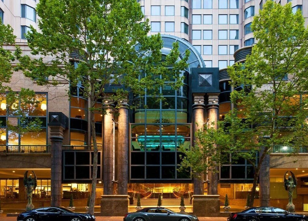 Elegant exterior view of Hair By Shlomi in Sydney, New South Wales, AU with lush trees and modern design.