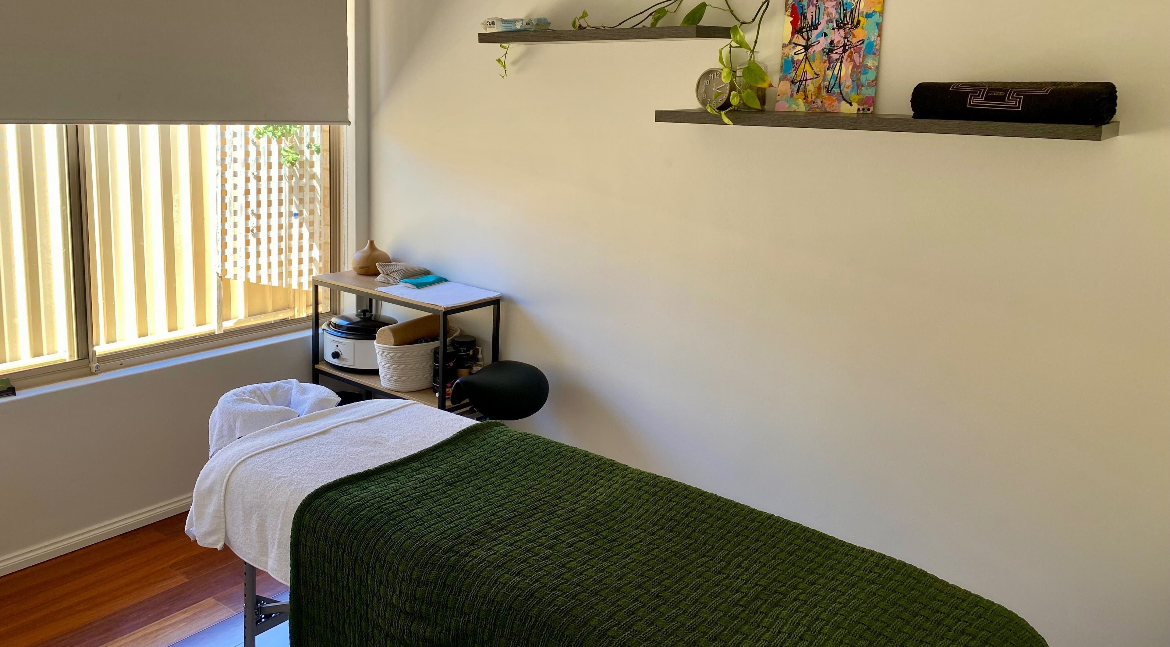 Tranquil massage room at Balanced Taurus Massage Therapy, Halls Head, Western Australia, AU with serene decor.