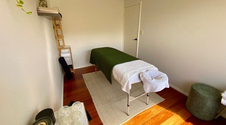 Massage table at Balanced Taurus Massage Therapy in Halls Head, Western Australia, AU with calming decor.