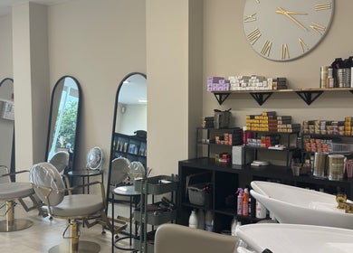 Chic salon interior at Hair by Sophie Ambrey in New Mills, England, GB, featuring modern seating and styling products.