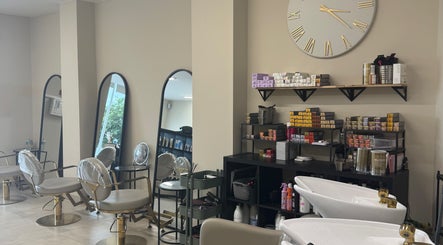 Chic salon interior at Hair by Sophie Ambrey in New Mills, England, GB, featuring modern seating and styling products.