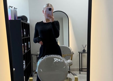 Modern hair studio at Hair by Sophie Ambrey in New Mills, England, GB, with elegant styling chair and mirror.