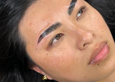 Client displaying expertly shaped eyebrows at Mysa Studio, Orpington, England, GB.