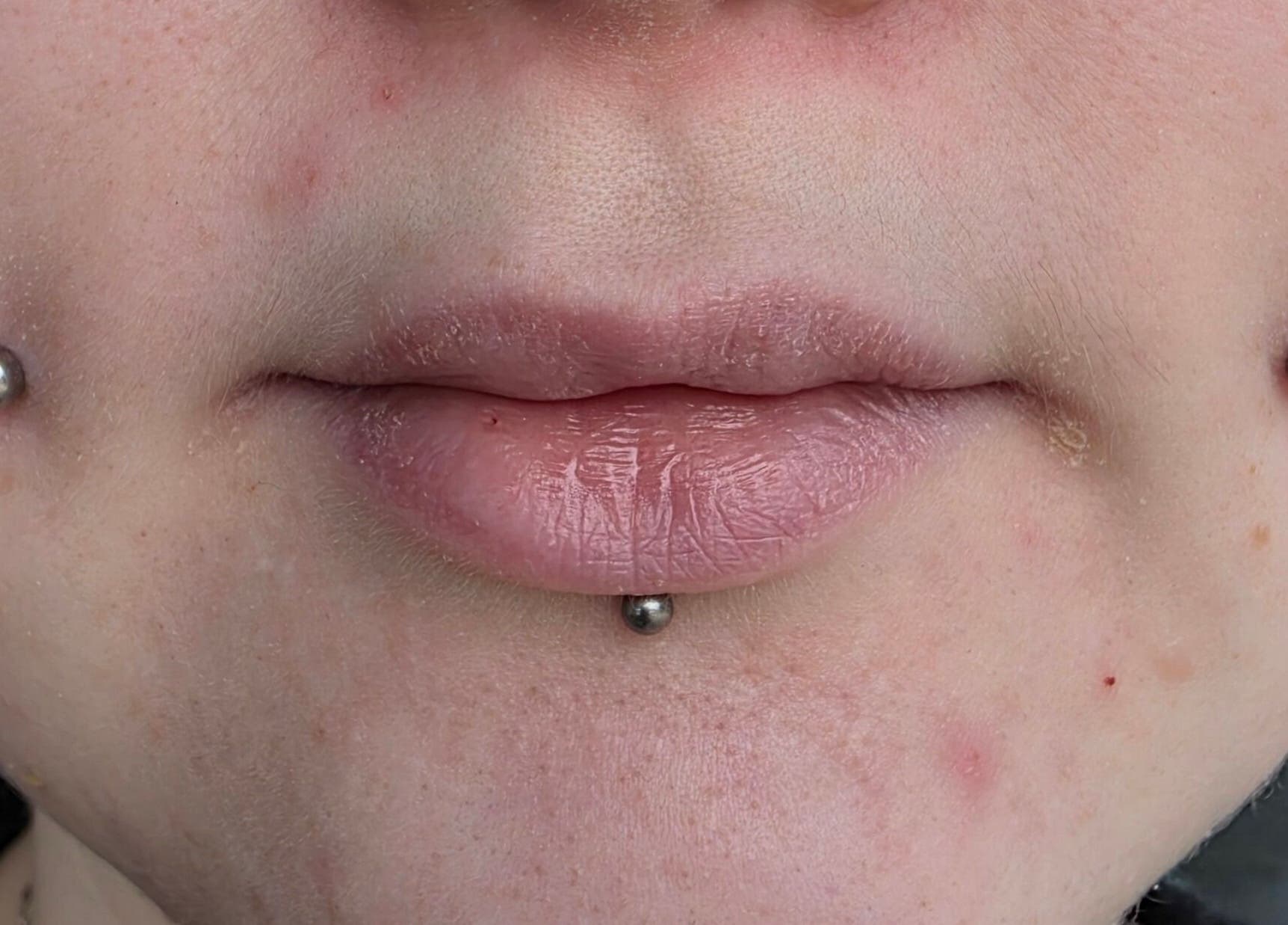 Close-up of unique facial piercings at Sharp Art Body Piercing in Langport, England, GB, showcasing expert craftsmanship.