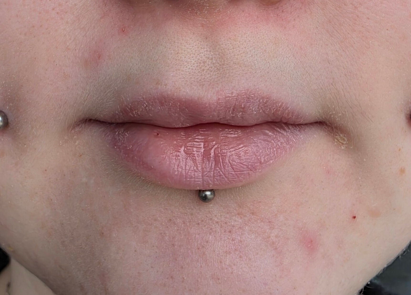Close-up of unique facial piercings at Sharp Art Body Piercing in Langport, England, GB, showcasing expert craftsmanship.