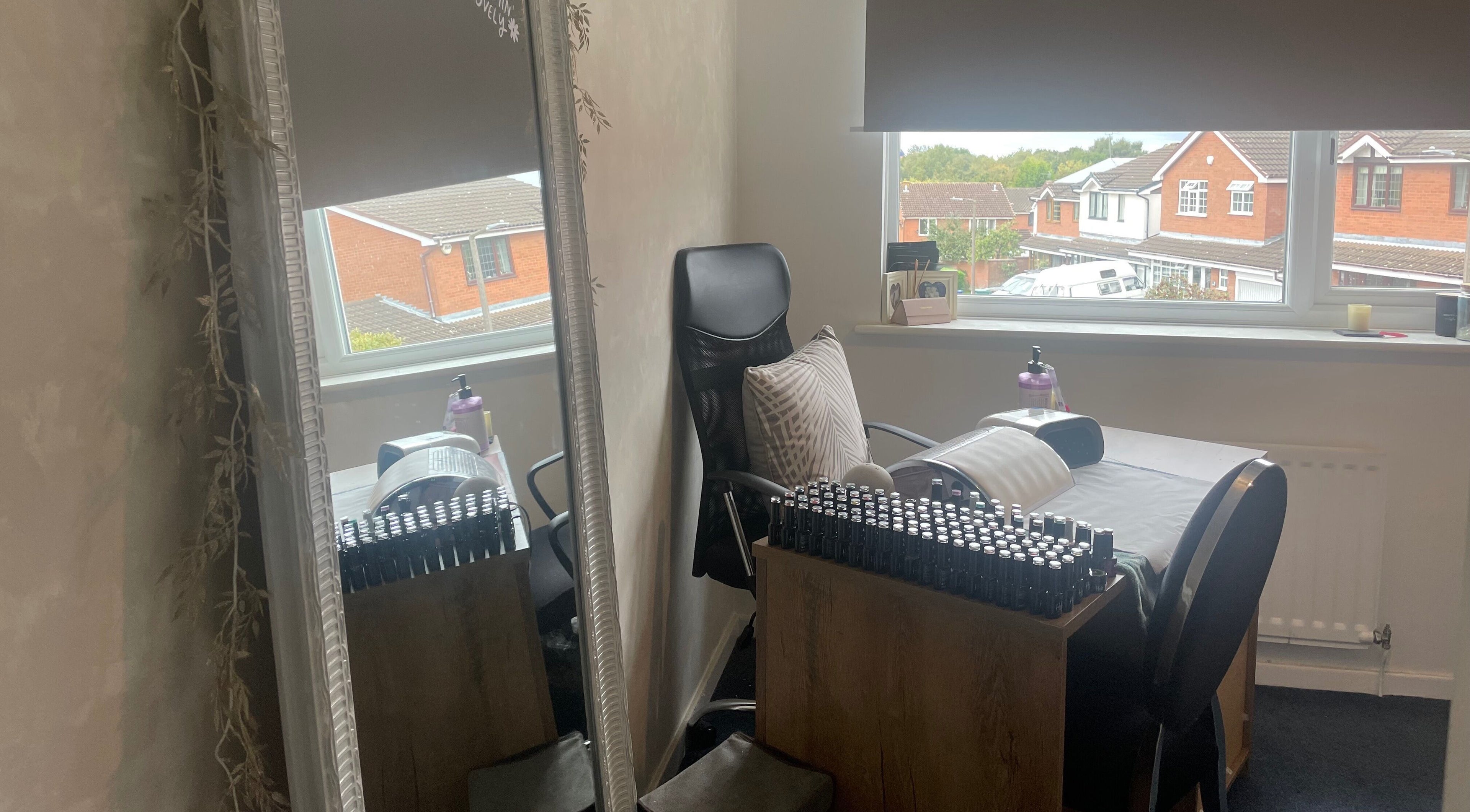 Cozy nail station at The Beautician - Beauty by Charlotte in Cannock, England, GB, with a view of serene neighborhood.