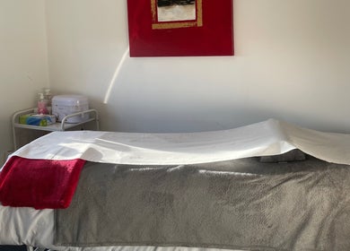 Relaxing treatment room at The Beautician - Beauty by Charlotte, Cannock, England, GB with plush linens.