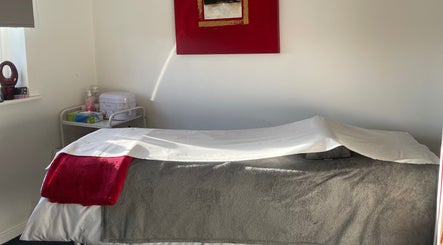 Relaxing treatment room at The Beautician - Beauty by Charlotte, Cannock, England, GB with plush linens.