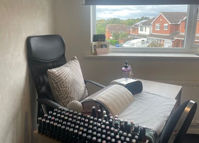 Nail station at The Beautician - Beauty by Charlotte in Cannock, England, GB, showcasing a cozy workspace with supplies.