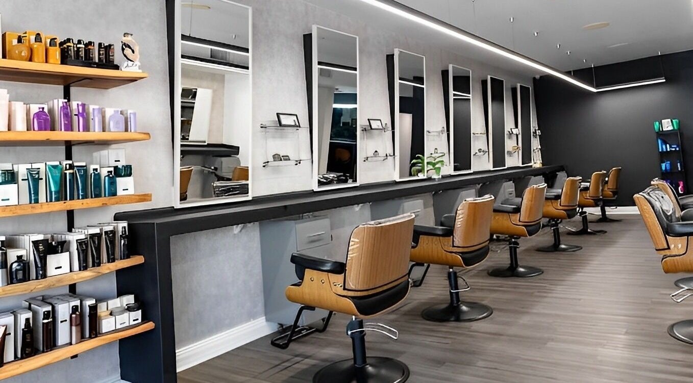 Sleek seating and product display at ACoLab Salon in Winter Park, Florida, US.