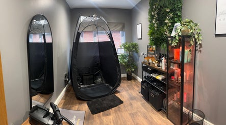 Sunless Glow tanning room with equipment and greenery in Leicester, England, GB.