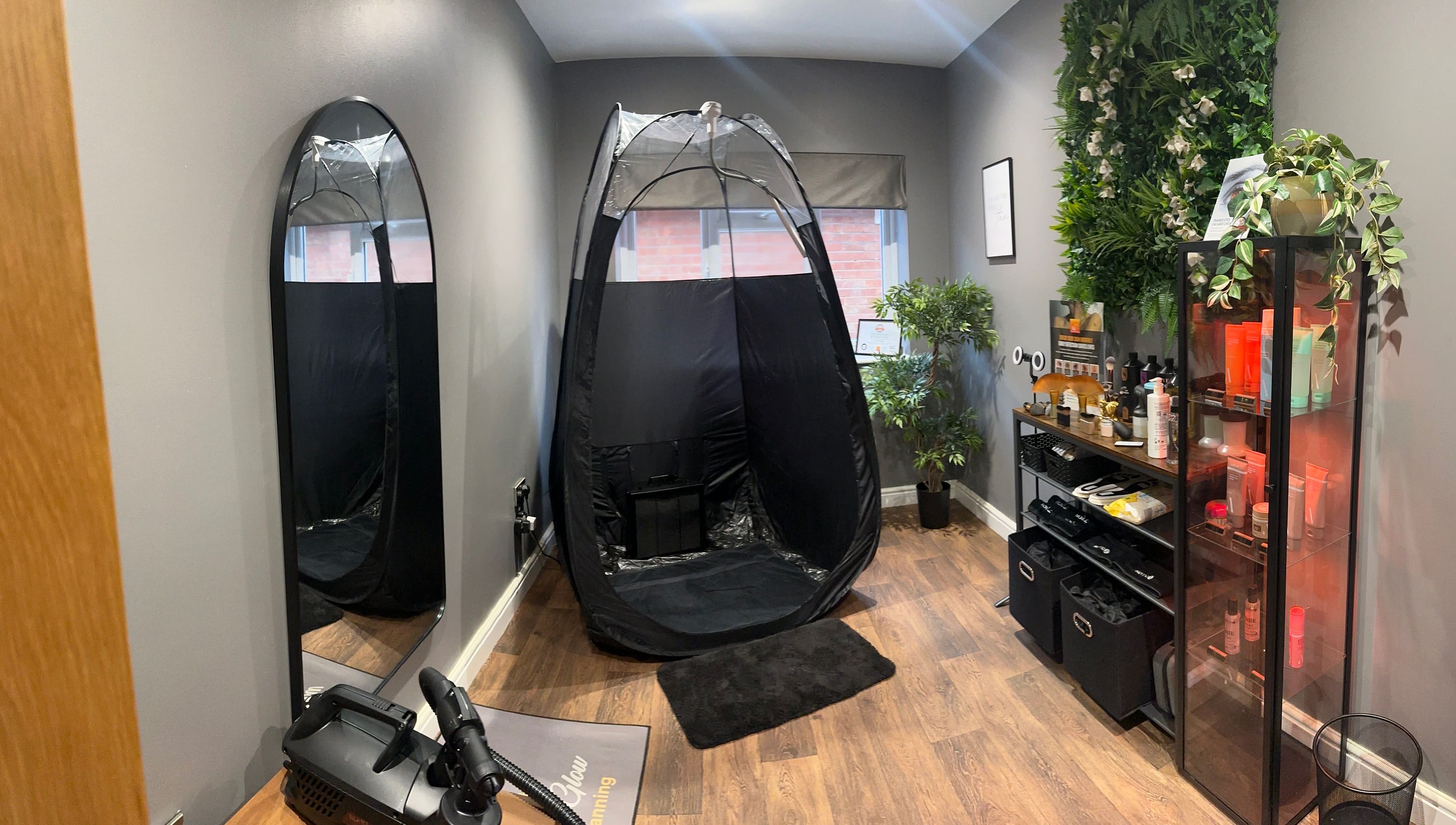 Modern tanning room with spray tent at Sunless Glow, Leicester, England, GB. Elegantly designed with plants and products.