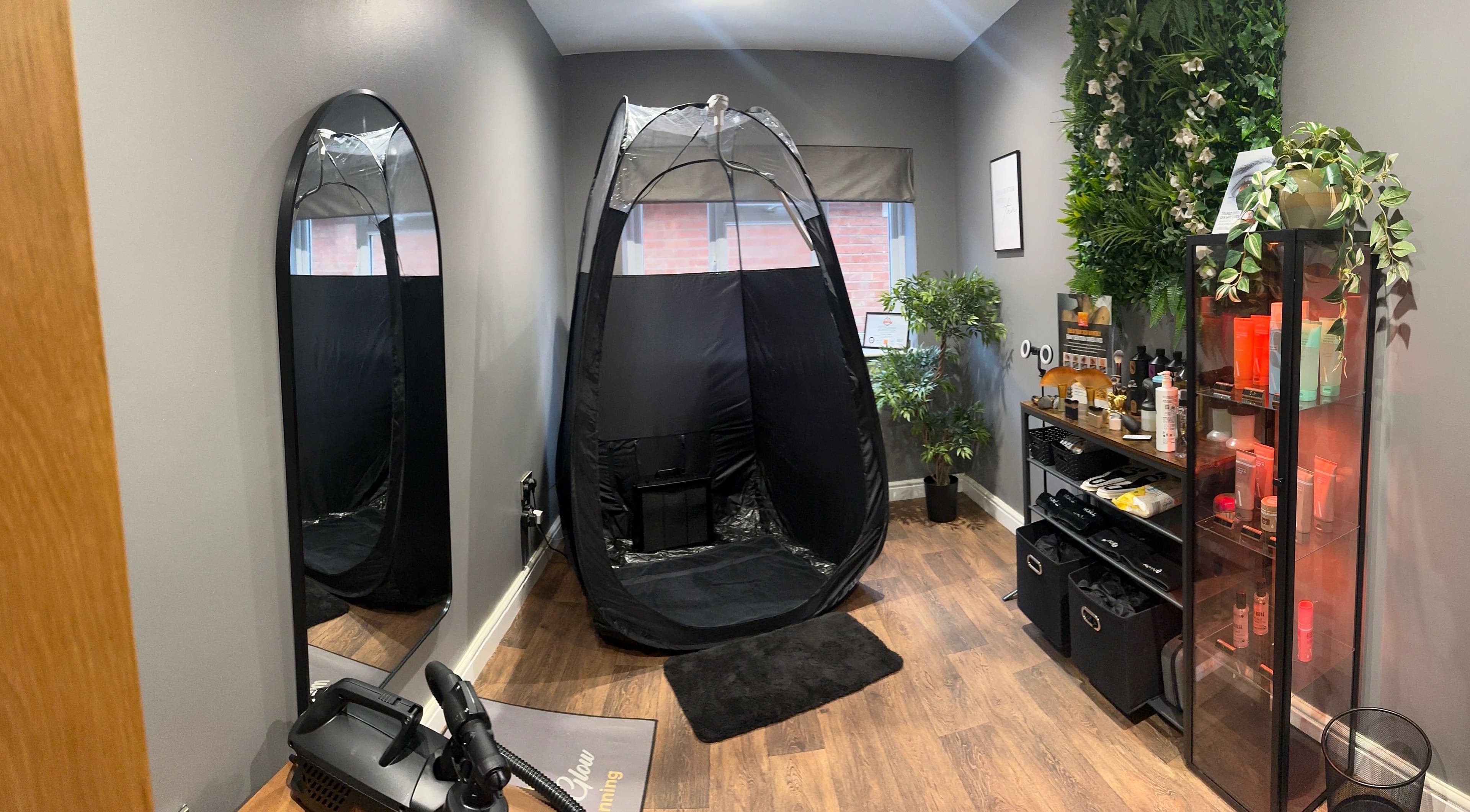 Modern tanning room with spray tent at Sunless Glow, Leicester, England, GB. Elegantly designed with plants and products.