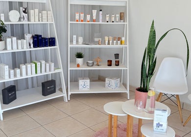 Product shelves at Derma Aesthetics, Walvis Bay, Erongo Region, NA showcasing beauty and skincare items.
