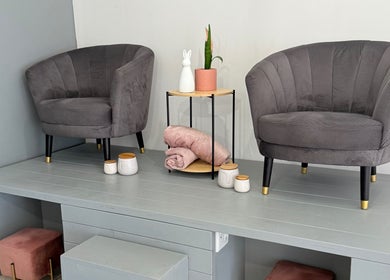 Elegant seating area at Derma Aesthetics, Walvis Bay, Erongo Region, NA with plush chairs and decor.
