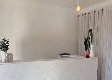 Elegant reception at Derma Aesthetics, Walvis Bay with modern decor and warm lighting.