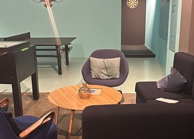 Cozy lounge at Seba_Hair.cutz, Rotterdam, Zuid-holland, NL with comfy seating and a foosball table.