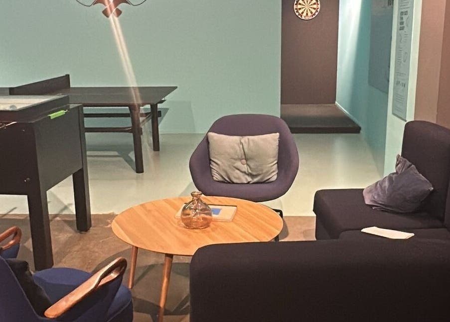 Cozy lounge at Seba_Hair.cutz, Rotterdam, Zuid-holland, NL with comfy seating and a foosball table.