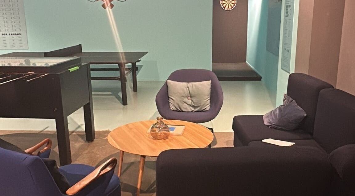Cozy lounge at Seba_Hair.cutz, Rotterdam, Zuid-holland, NL with comfy seating and a foosball table.