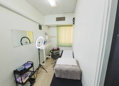 Treatment room at LashAura Beauty Spa in Kingston, St. Andrew Parish, JM with a bed and beauty tools.