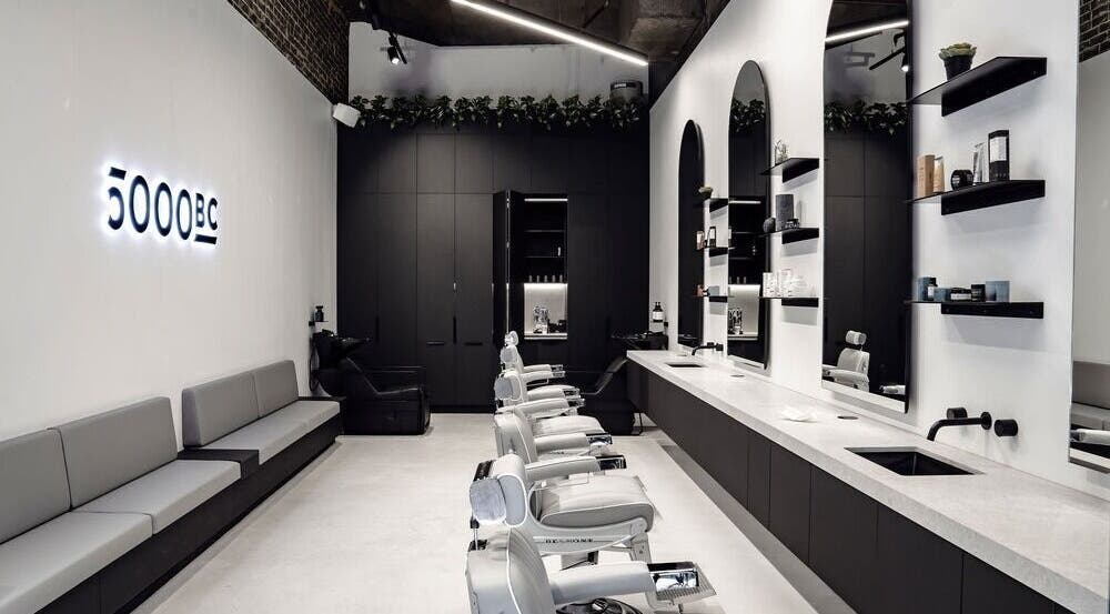 Interior view of 5000 BC salon in Sydney, New South Wales, AU, featuring modern design and barber chairs.