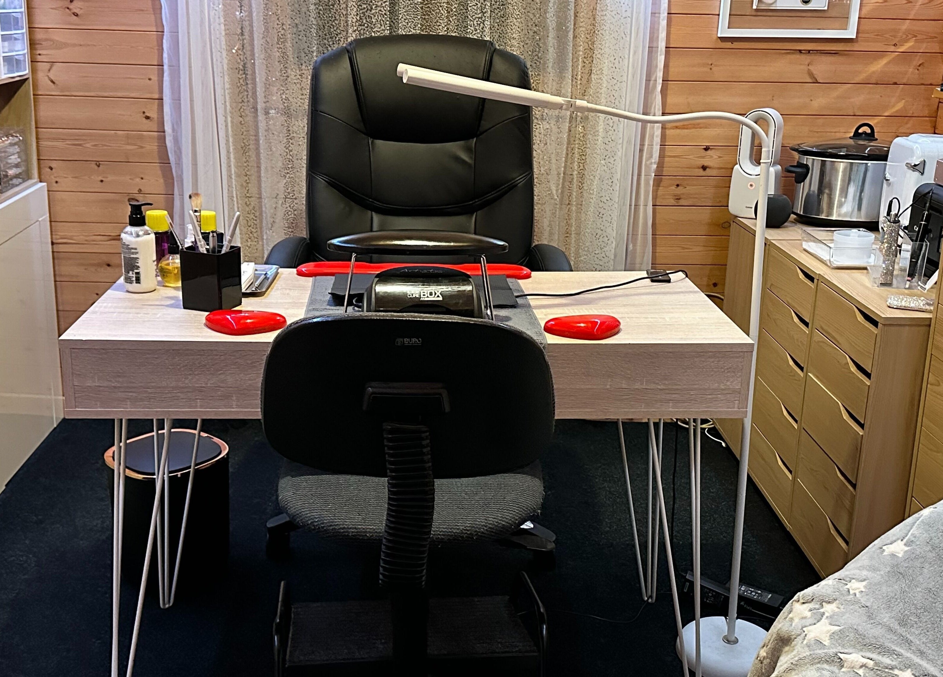 Nail station at The Dolls House Nail Studio, Renwick, Marlborough, NZ with tools and comfy chair.