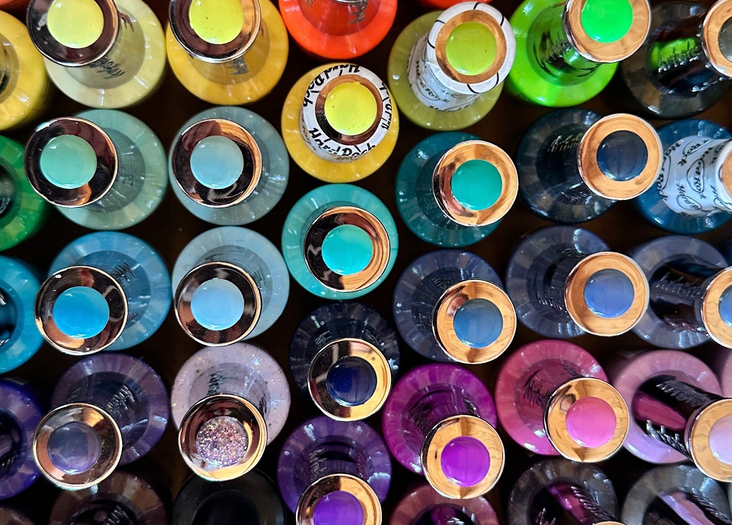 Bright nail polish bottles displayed at The Dolls House Nail Studio in Renwick, Marlborough, NZ.