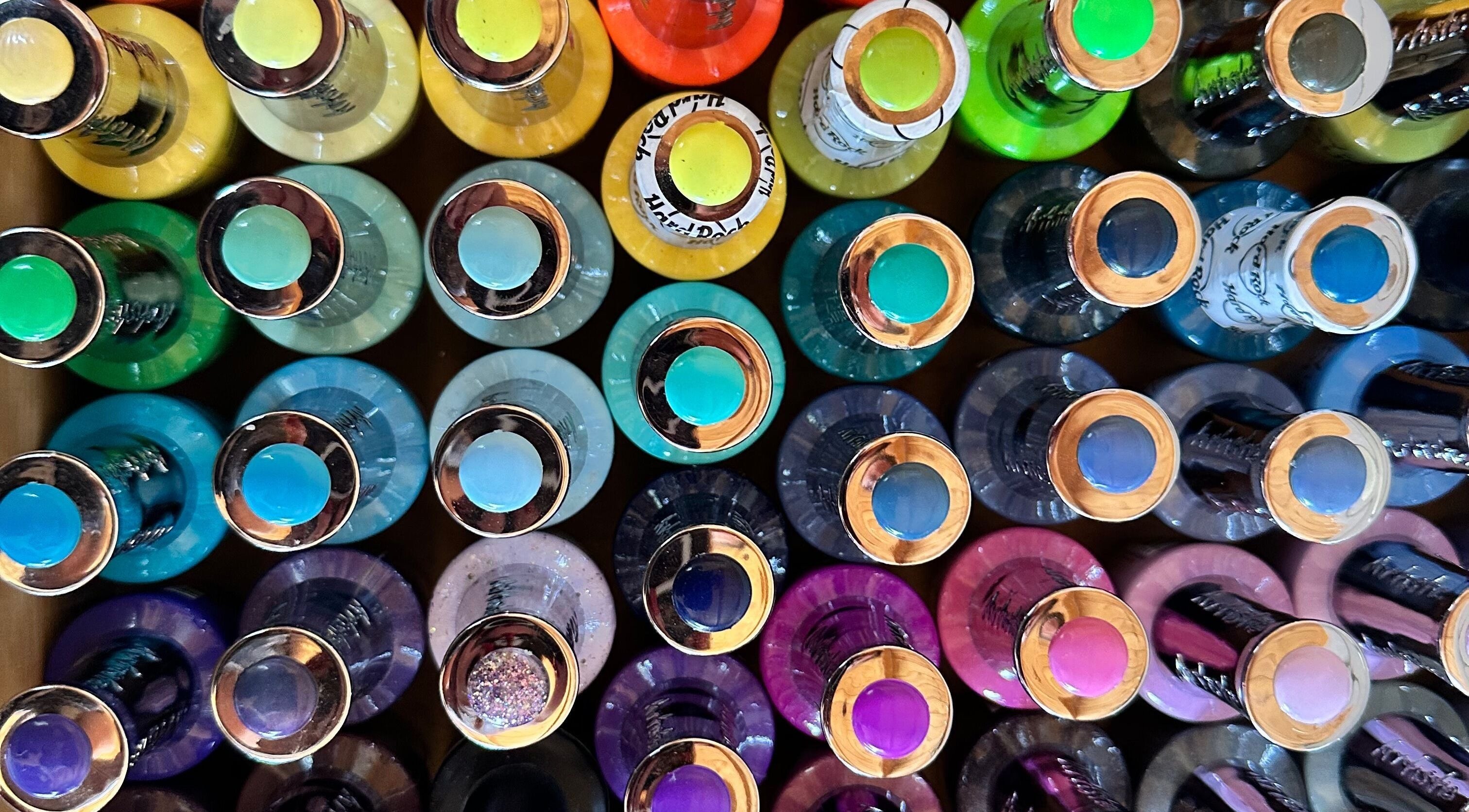 Bright nail polish bottles displayed at The Dolls House Nail Studio in Renwick, Marlborough, NZ.