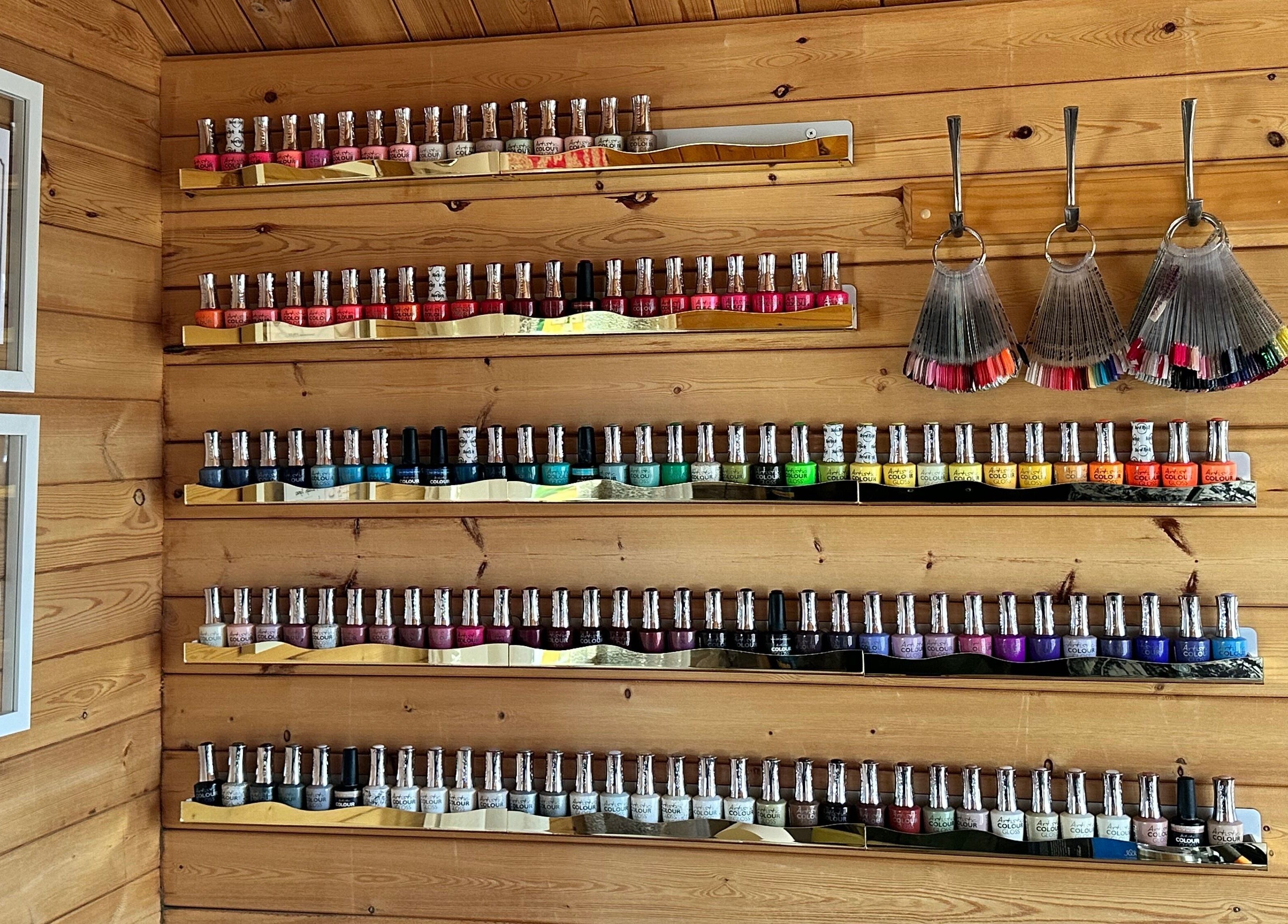 Colorful nail polish selection at The Dolls House Nail Studio, Renwick, Marlborough, NZ, showcasing vibrant options.