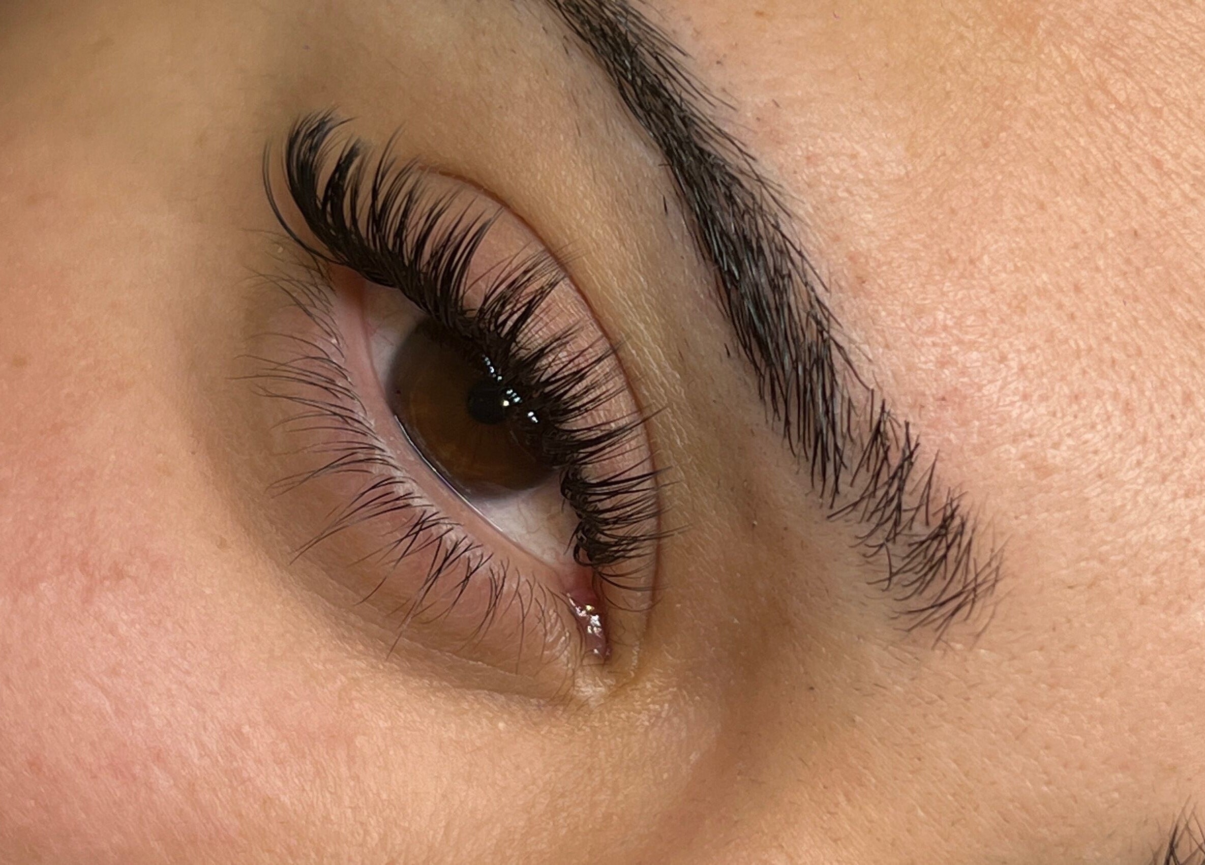 Close-up of expertly groomed eyelashes and brows at Scarlett lash & brow, Melbourne, Victoria, AU.