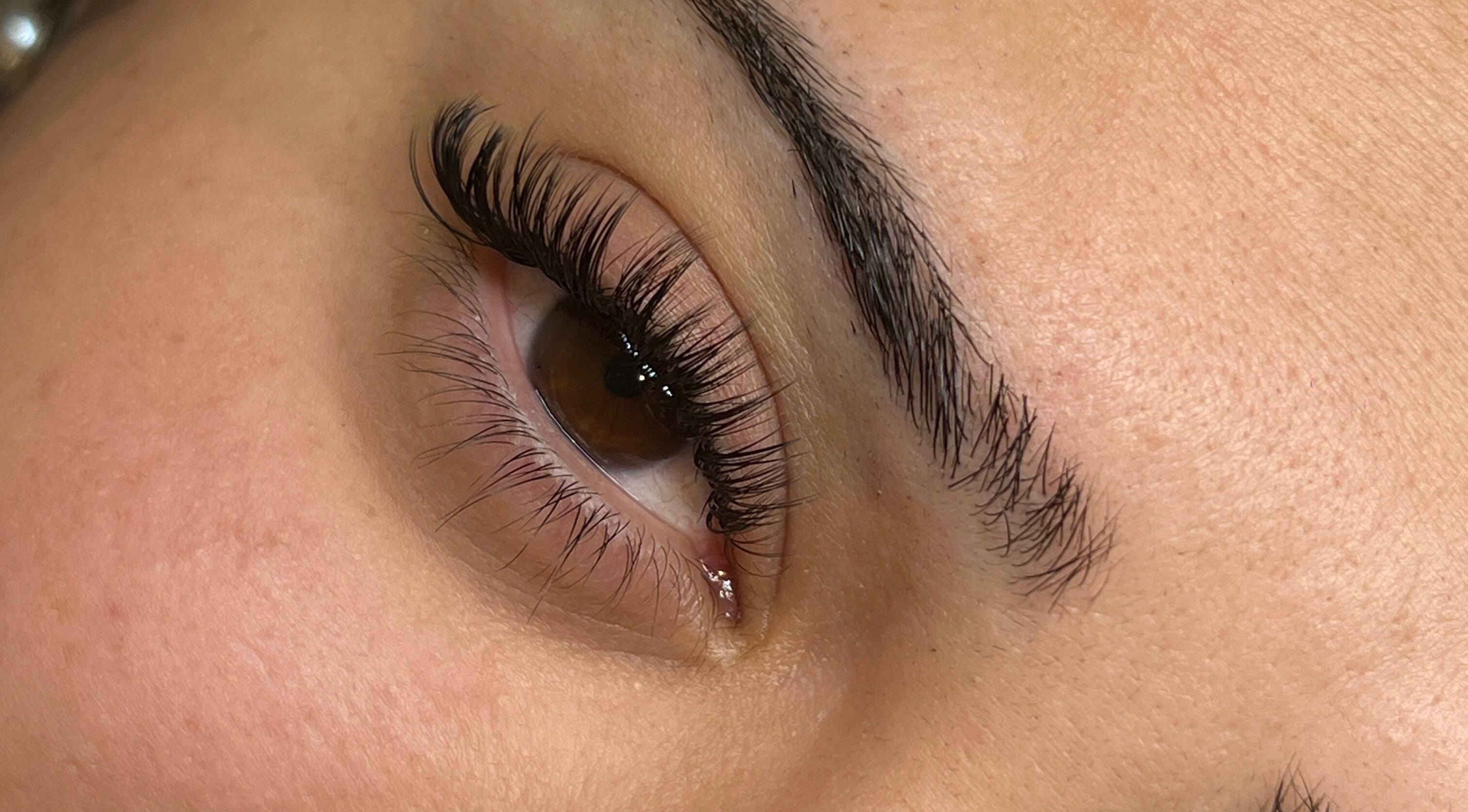 Close-up of expertly groomed eyelashes and brows at Scarlett lash & brow, Melbourne, Victoria, AU.