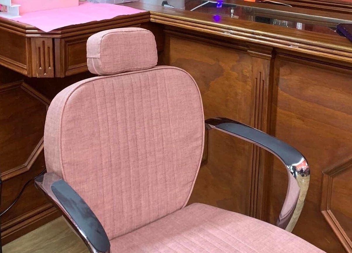 Plush pink salon chair at LaLaBeauty Studios, Dayboro, Queensland, AU, featuring polished wooden finish.