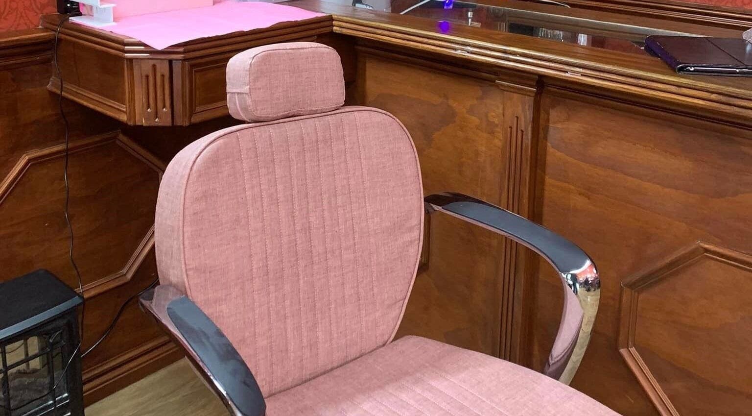 Plush pink salon chair at LaLaBeauty Studios, Dayboro, Queensland, AU, featuring polished wooden finish.