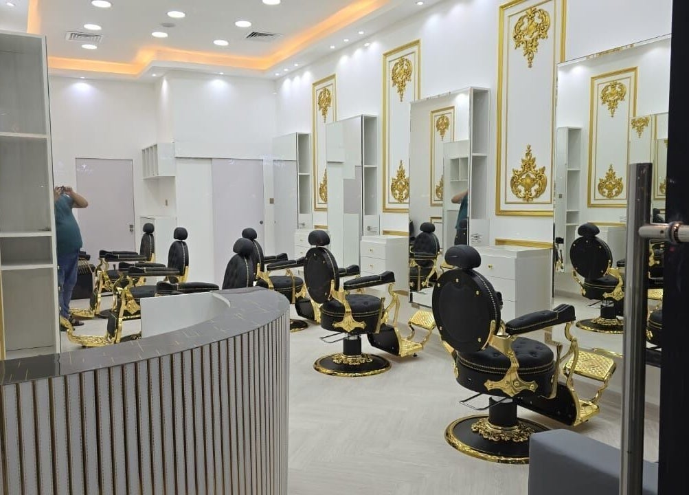 Luxurious interior of Dove Barbershop in Dubai, Dubai, AE featuring ornate chairs and gold accents.