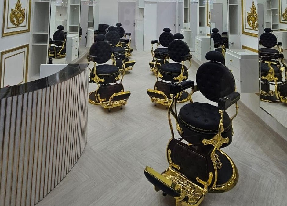 Elegant black and gold barber chairs at Dove Barbershop in Dubai, Dubai, AE, reflecting luxury and style.