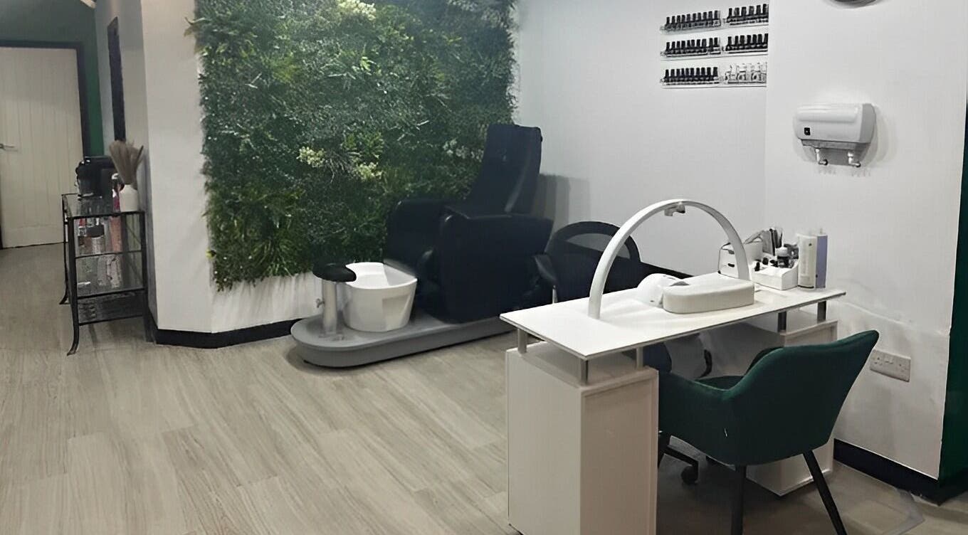 Relaxing nail station at Hair and Beauty Hub, Kettering, England, GB with a green plant wall feature.
