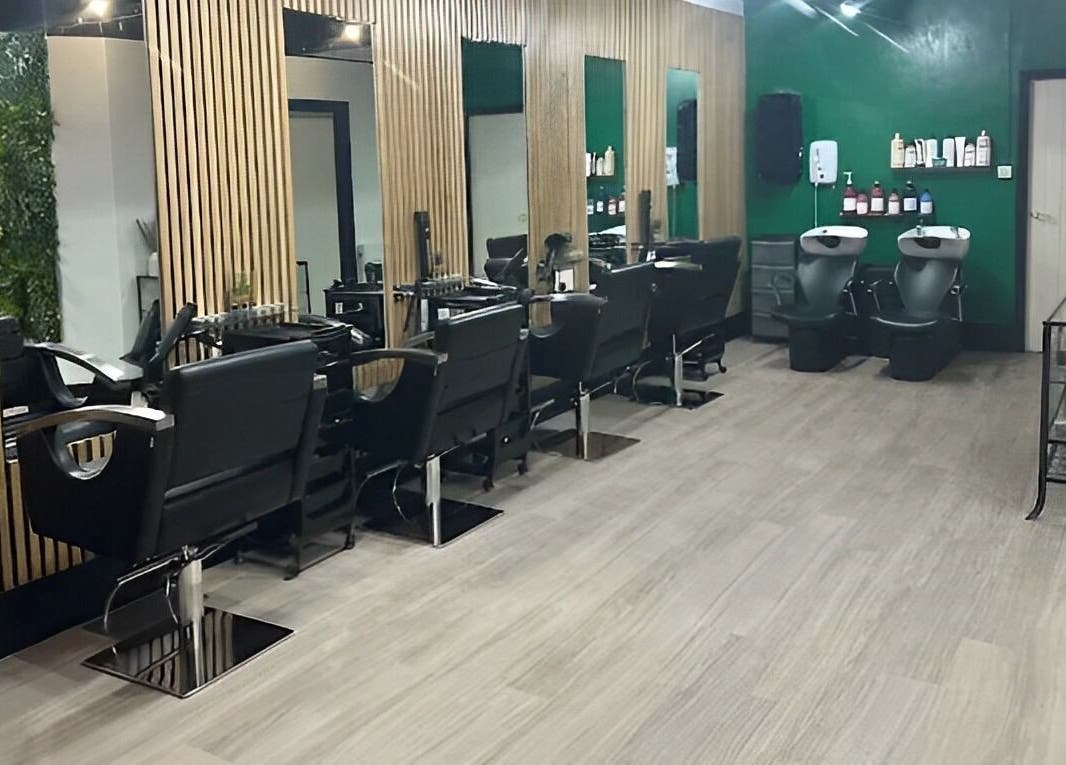 Modern salon at Hair and Beauty Hub, Kettering, England, GB with sleek chairs and wooden accents.
